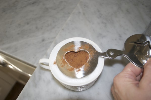 Making cinammon heart with stainless froth stencils