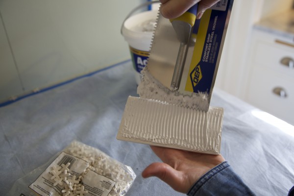 White subway tile installation